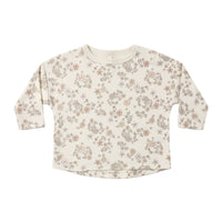 Floral patterned long-sleeve shirt on a white background.