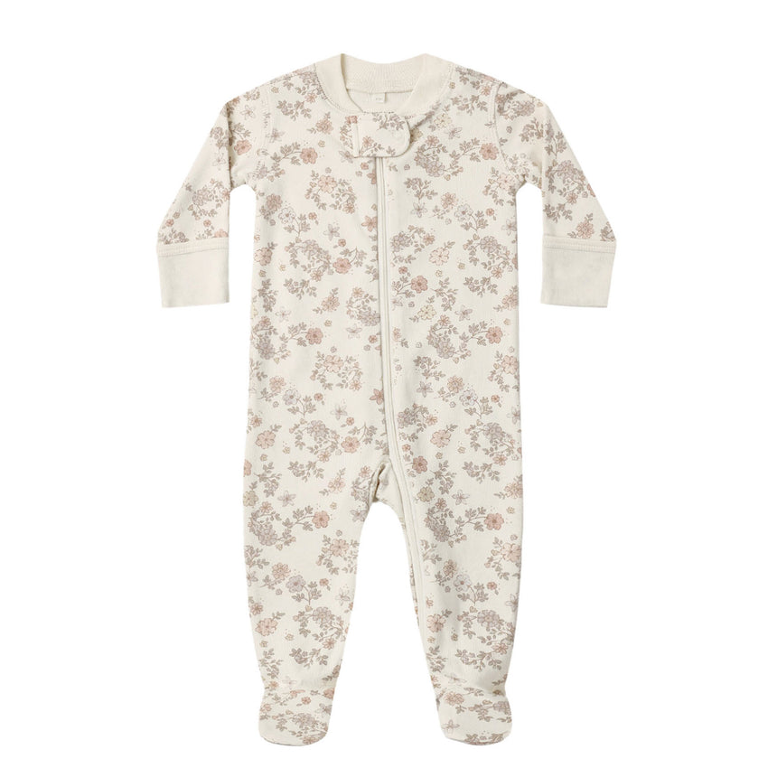 Floral patterned baby footie on a white background.