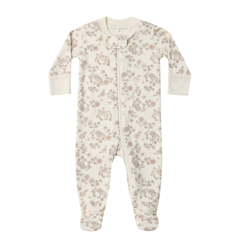Floral patterned baby footie on a white background.