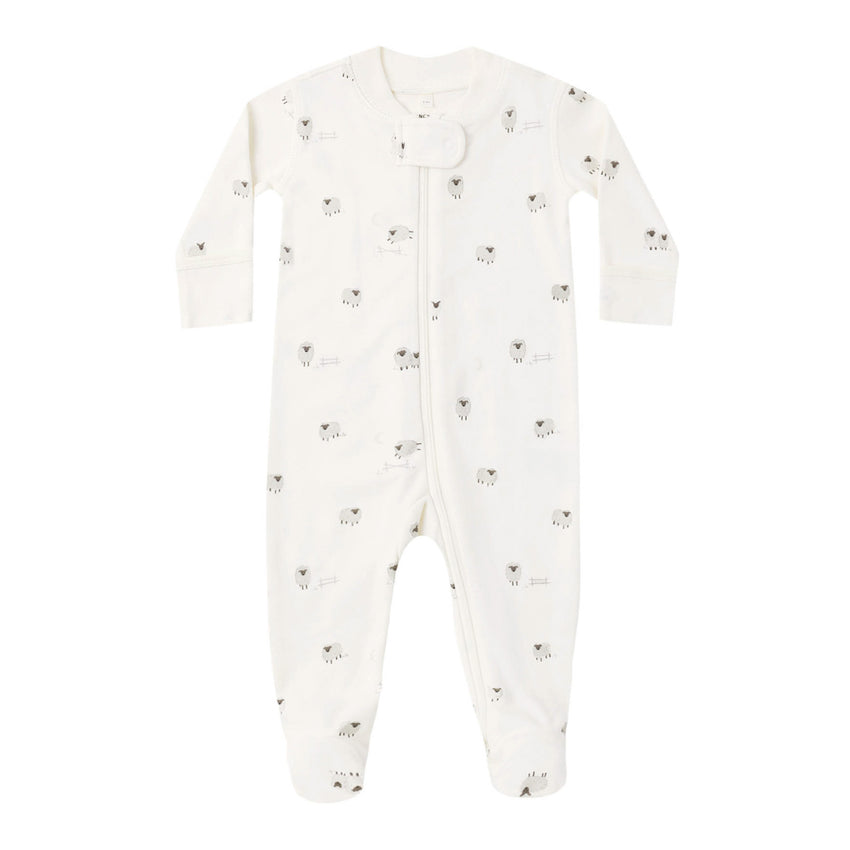 White baby footie  with small sheep patterns on a white background.