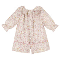 Back of floral dress with long sleeves on a white background.