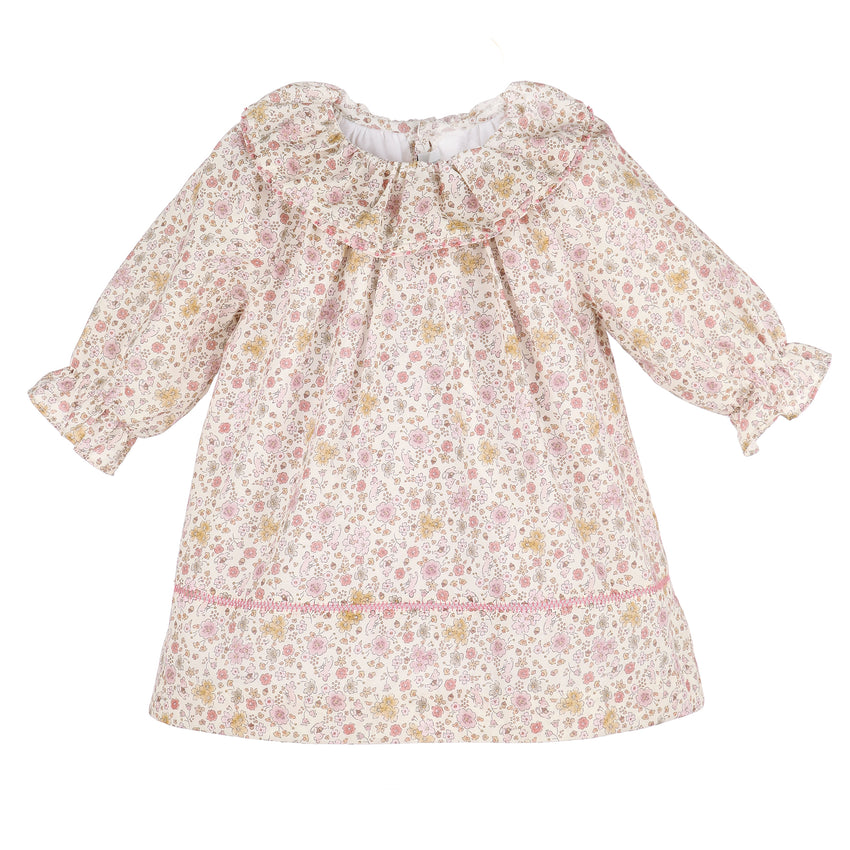 Pink floral patterned dress with ruffled collar and sleeve cuffs on a white background.
