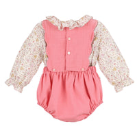 Back of pink baby romper with floral long-sleeve shirt on a white background.
