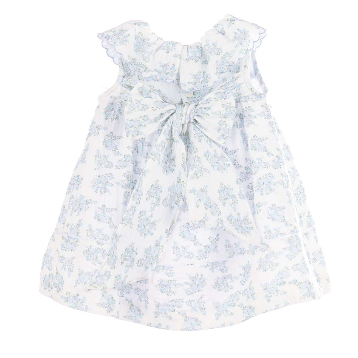 Back view of a white dress with blue floral pattern and bow on a white background.