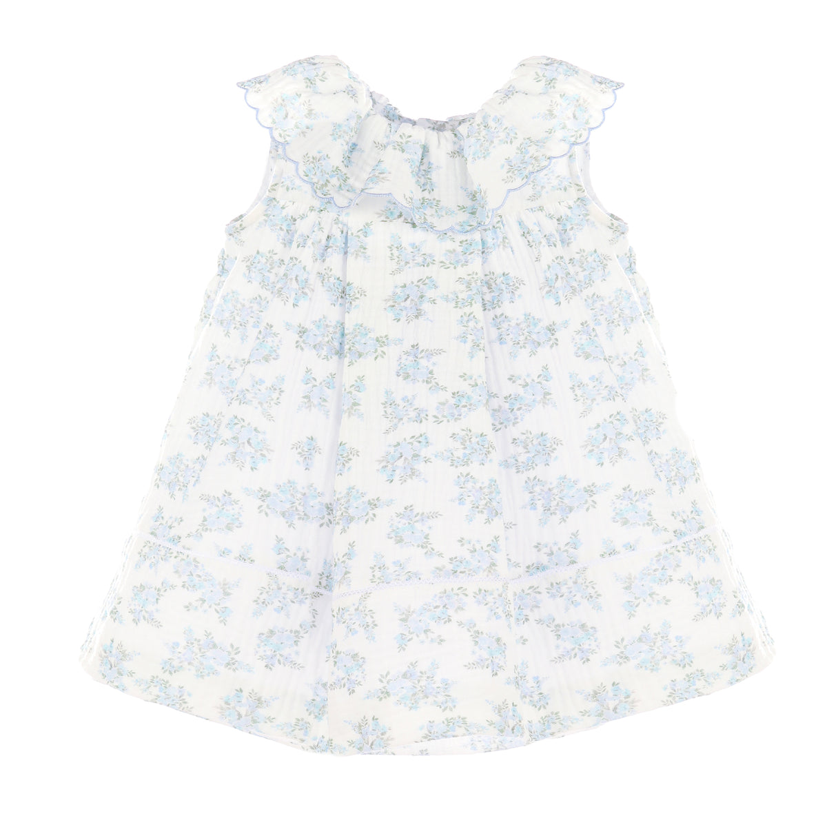 Sleeveless white dress with blue floral pattern on a white background.