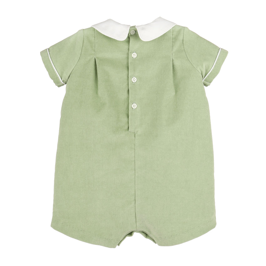 A sage green short-sleeve romper with a white Peter Pan collar, white button placket, and white piping on the sleeve cuffs, shown against a plain white background.