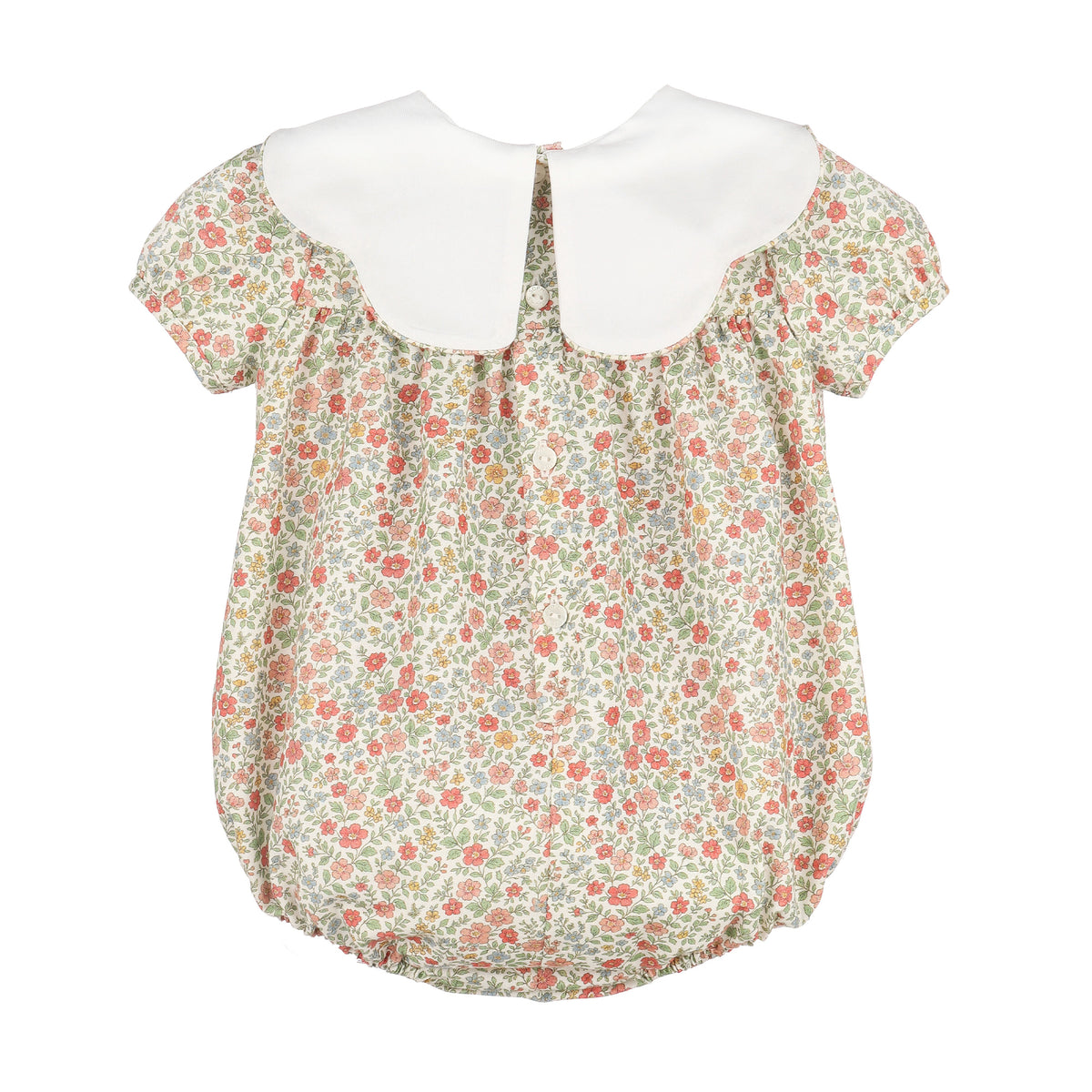 A girl's short-sleeve blouse featuring a white Peter Pan collar and a delicate floral print bodice with a ruffled hem.