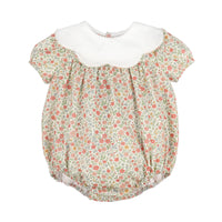 A short-sleeve bubble romper with a white Peter Pan collar, featuring a delicate red and green floral print on a light beige background.