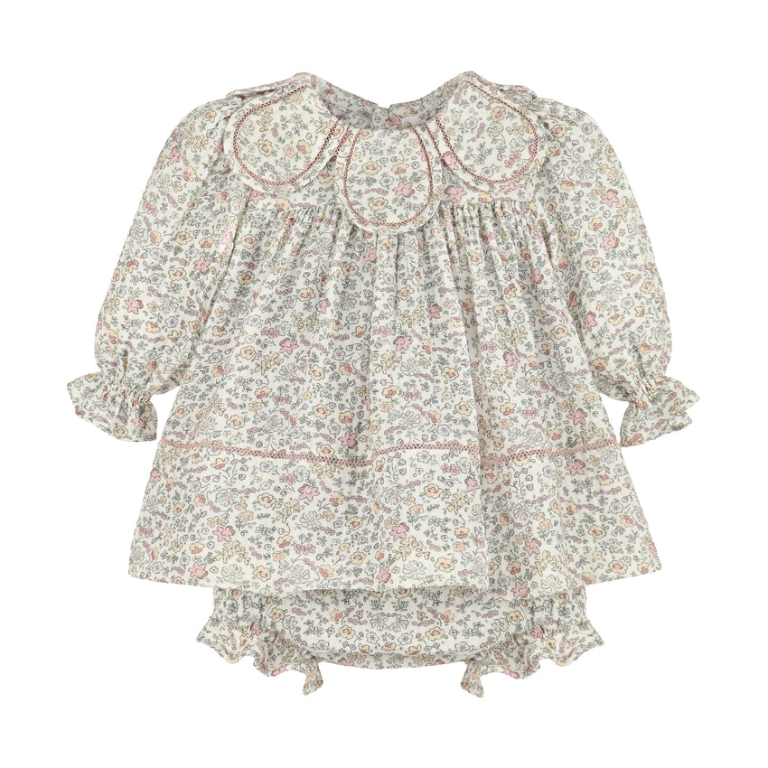Floral print dress with petal collar with long sleeves and bloomers on a white background.