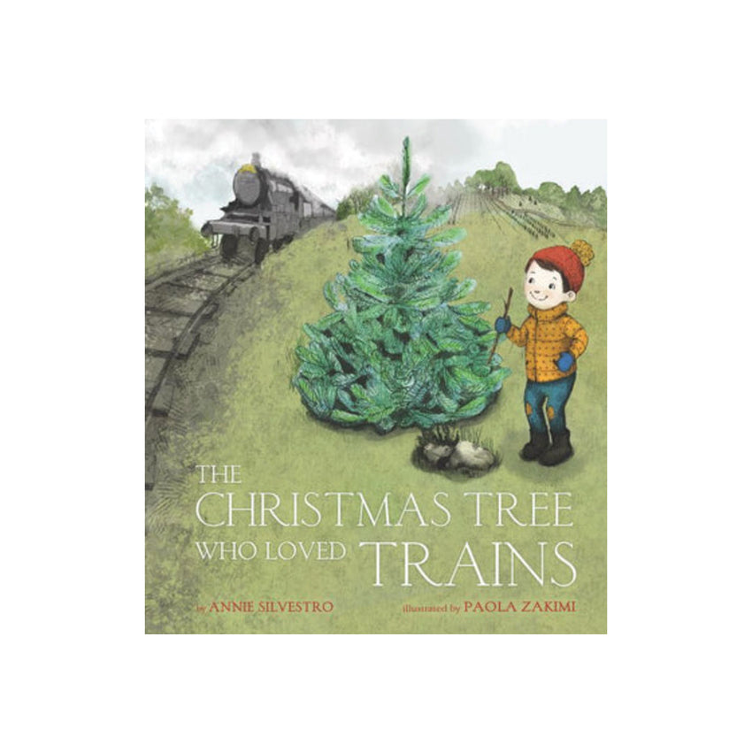 Children's book cover titled "The Christmas Tree Who Loved Trains" by Annie Seleyro, illustrated by Paola Zarmi, showing an illustrated child beside a Christmas tree on a grassy hill with a train in the background.