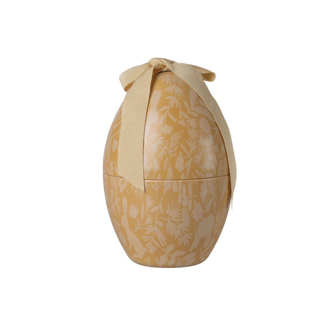 Decorative item with floral pattern and ribbon on a white background.